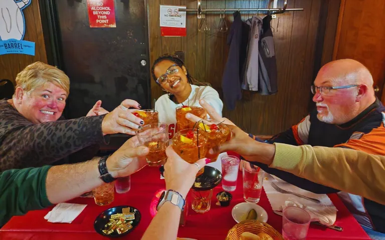 toasting and having drinks before a meal at a Wisconsin Supper Club