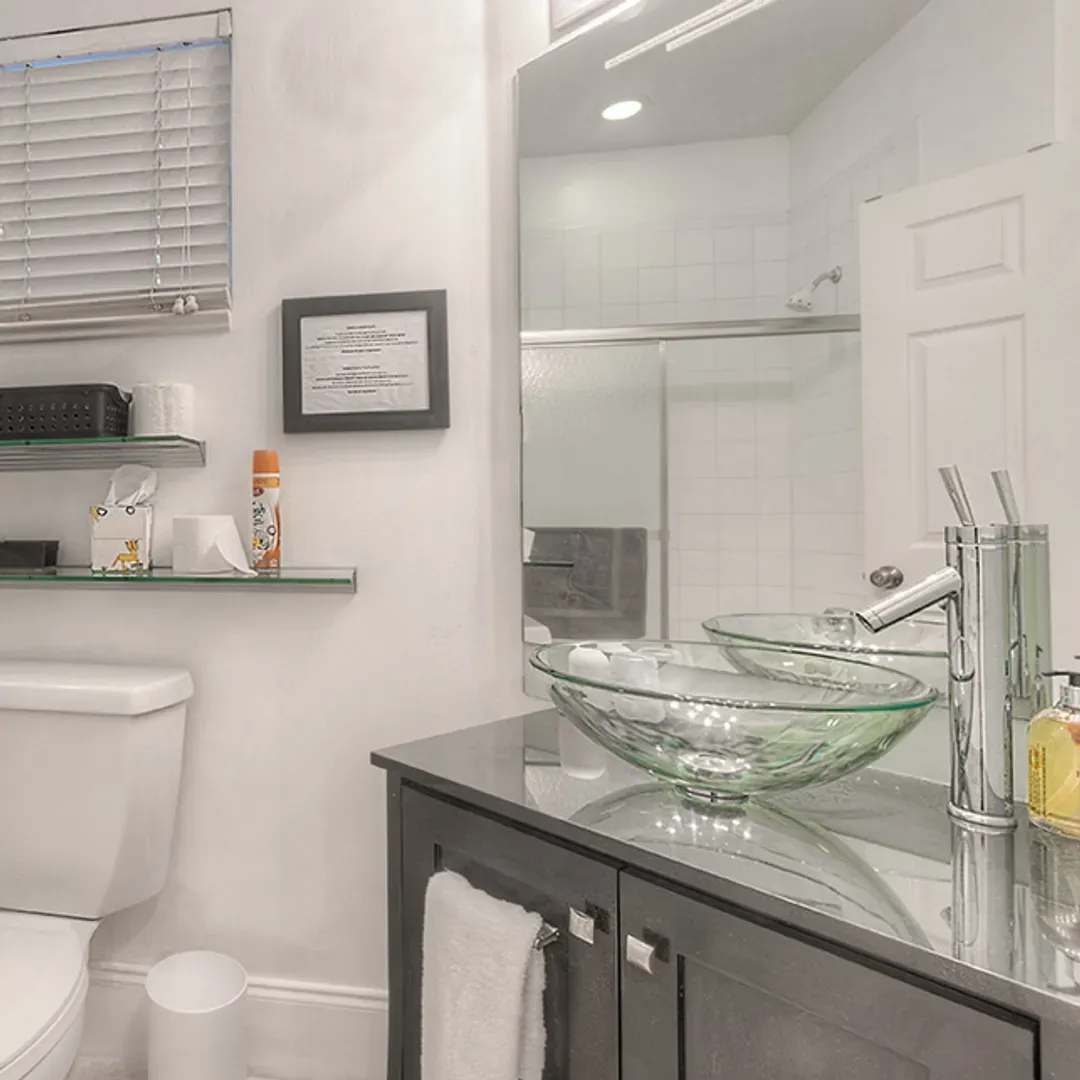Sleek Elegance: Modern Vessel Sink and Double Mirror Wall Cabinets