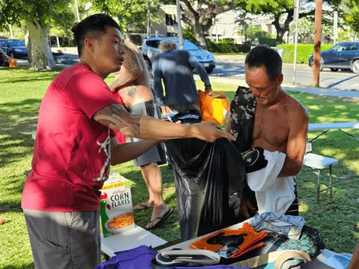 David helping Mike find clothes August 26 2023 512x384 c