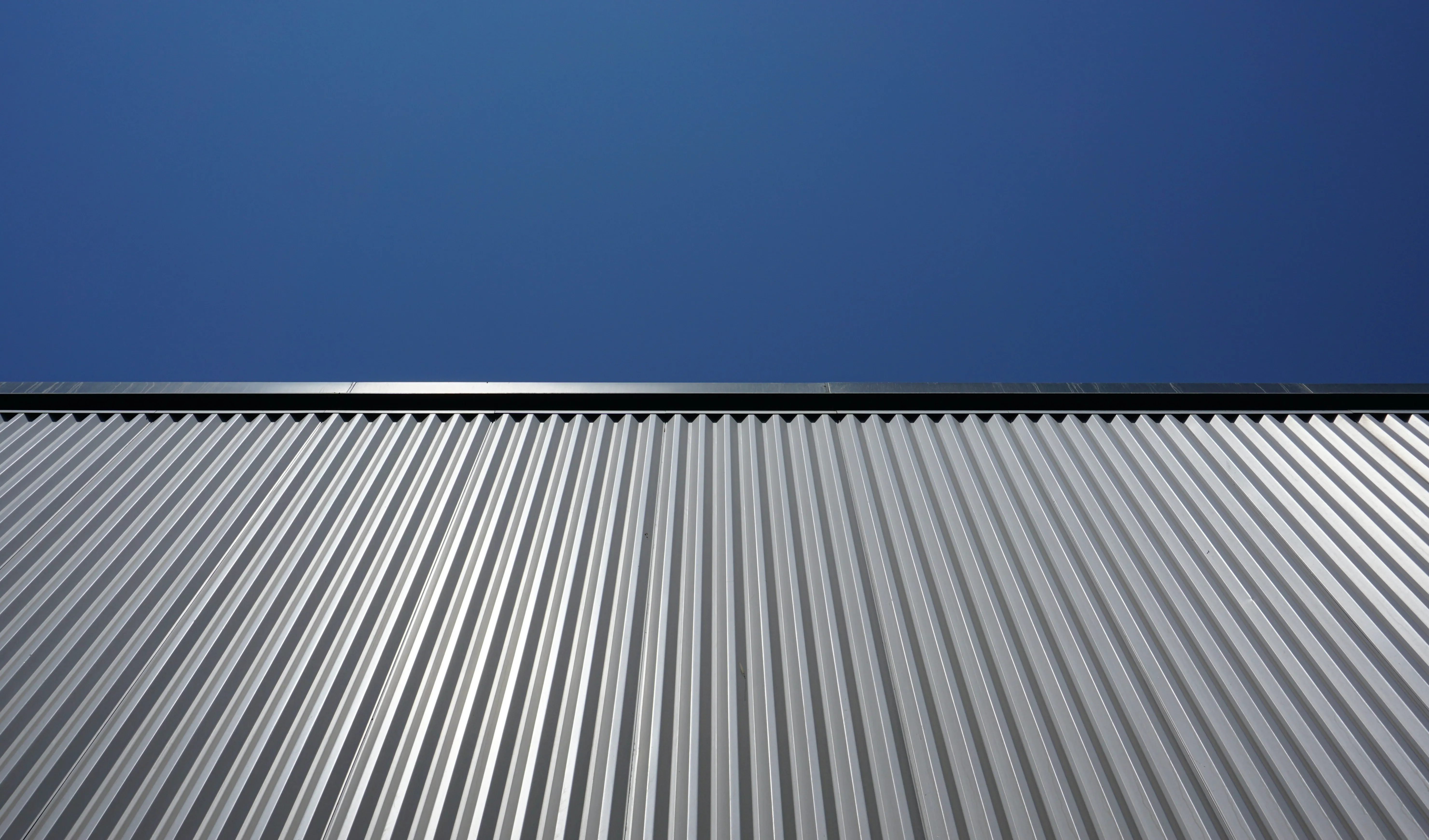 Gray-metal-roof-with-blue-sky