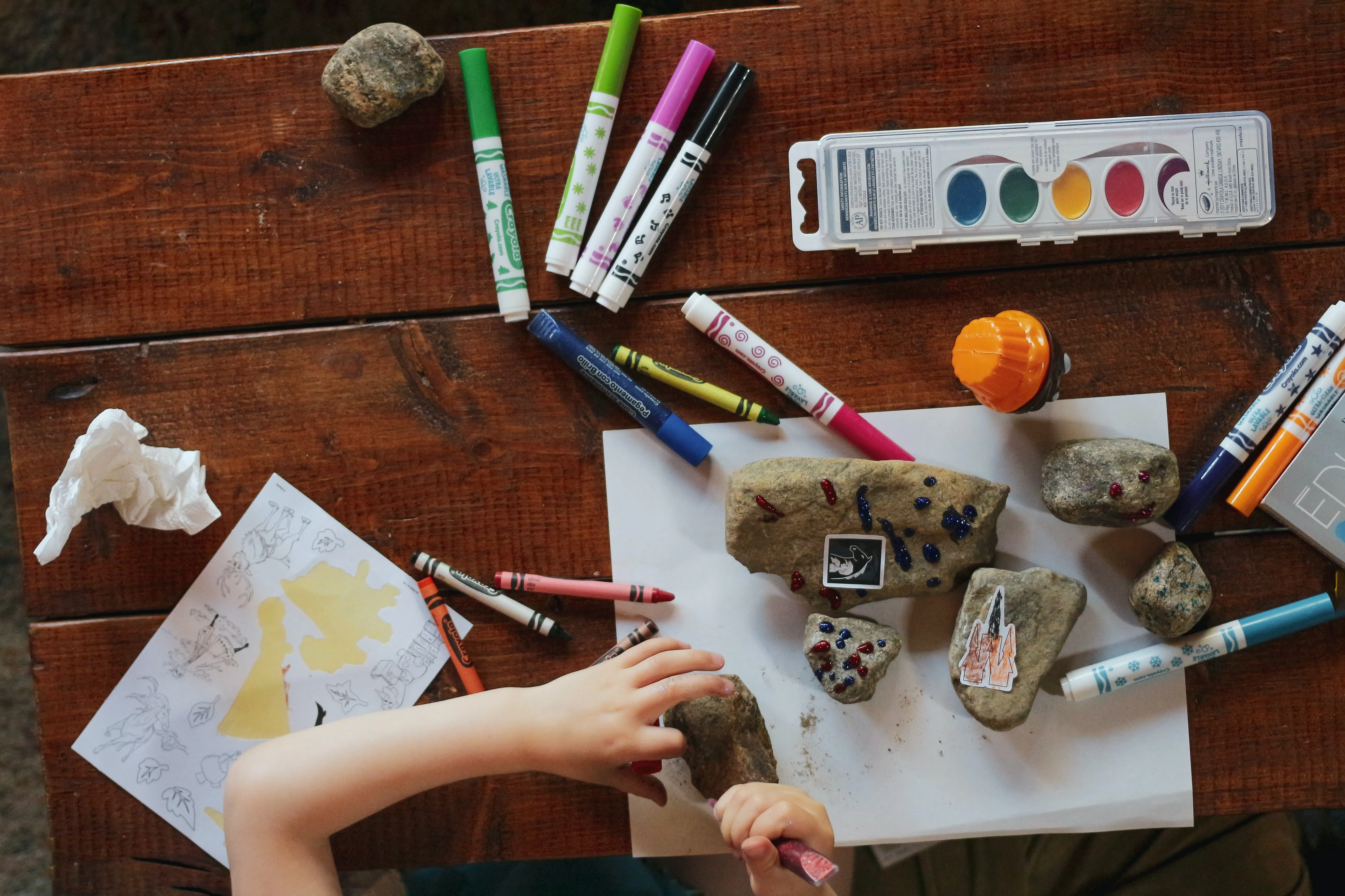 Child Painting Rocks