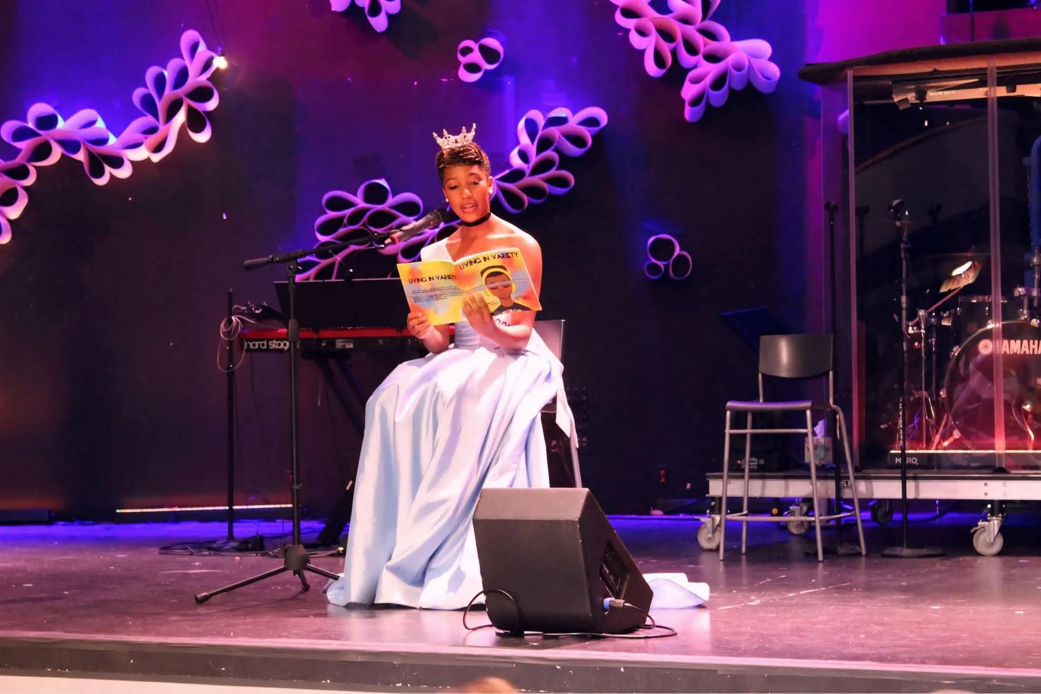 author and Miss North Kansas City reading book