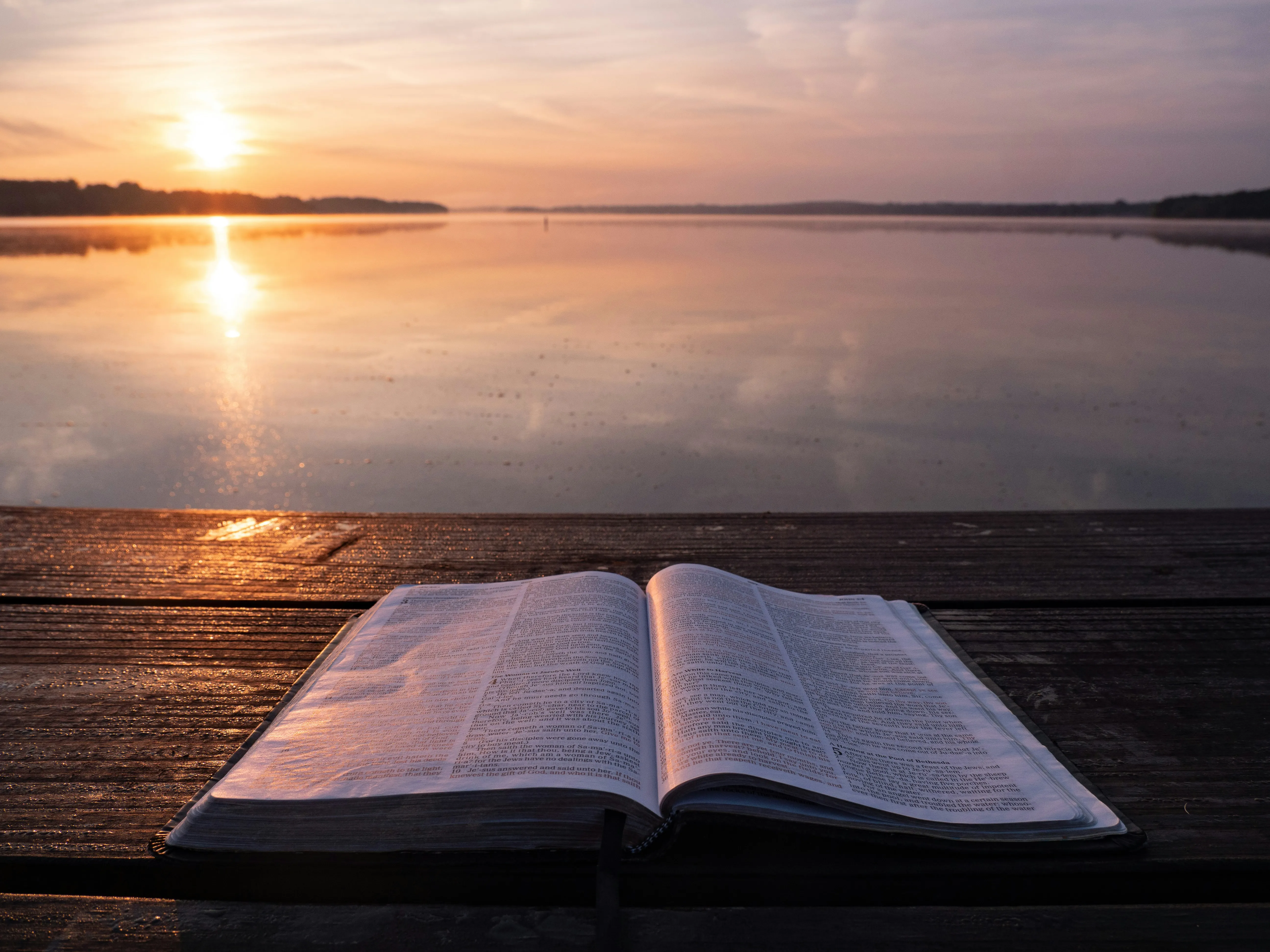 image of an open bible with sun going down, representing to research truth