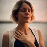 Woman with hand over heart