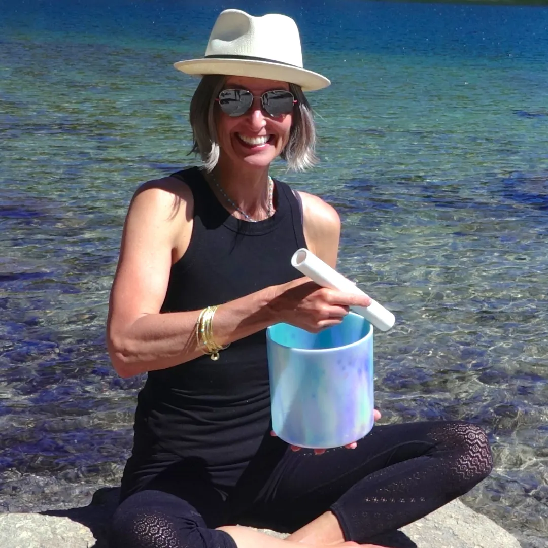 Dawn Playing Crystal Bowls near a lake in Mammoth Lakes, CA