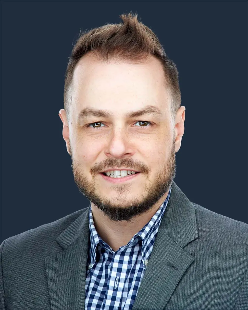 Headshot of Jared Wolfe, the CEO and lead photographer of Jared Wolfe Portraits