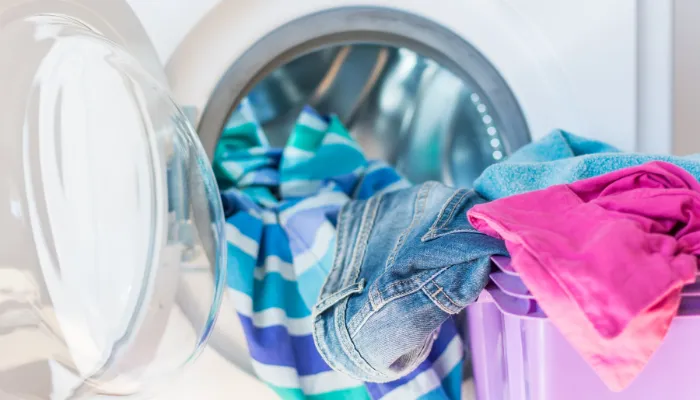 Bright colored clothes and a dryer.