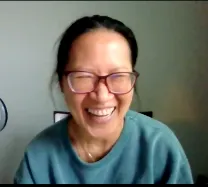 Anh Truong Smiling in her green scru