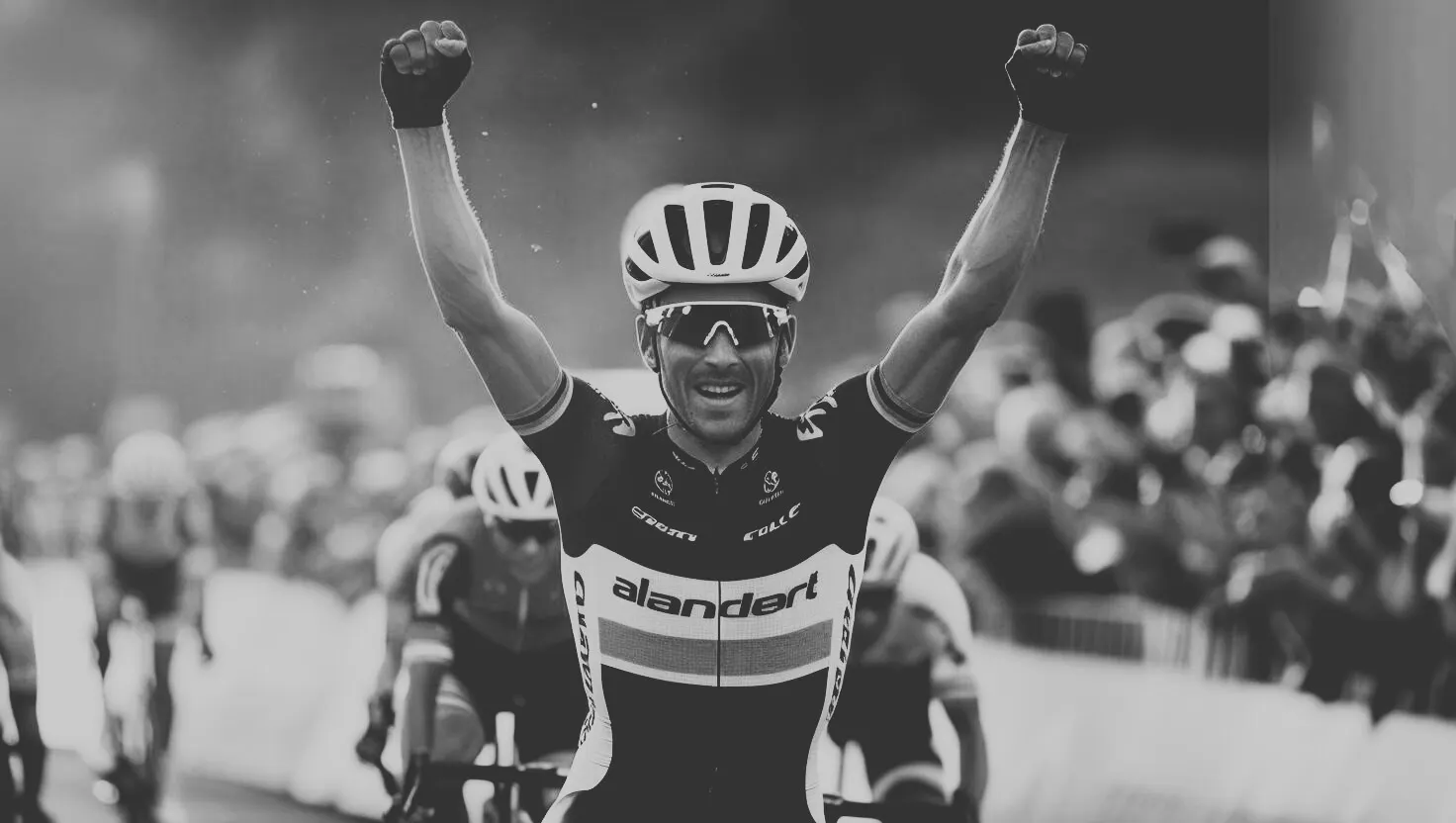 Cyclist Winning Race With Arms In The Air