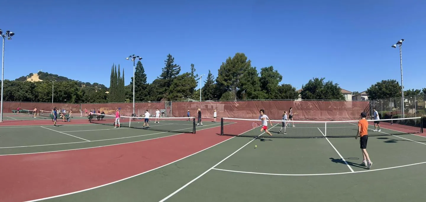 64 Youth playing tennis