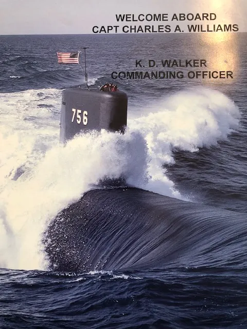 Welcome aboard Captain Charles Williams. Submarine surfaces in the sea