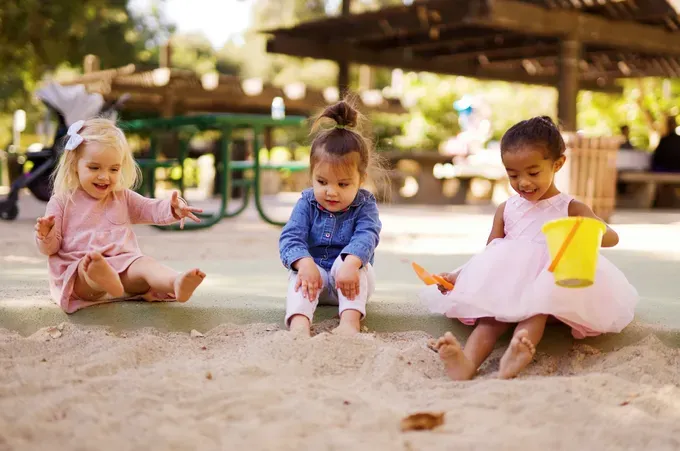 Babies playing in the sand