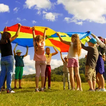 Kids playing with a Parachute