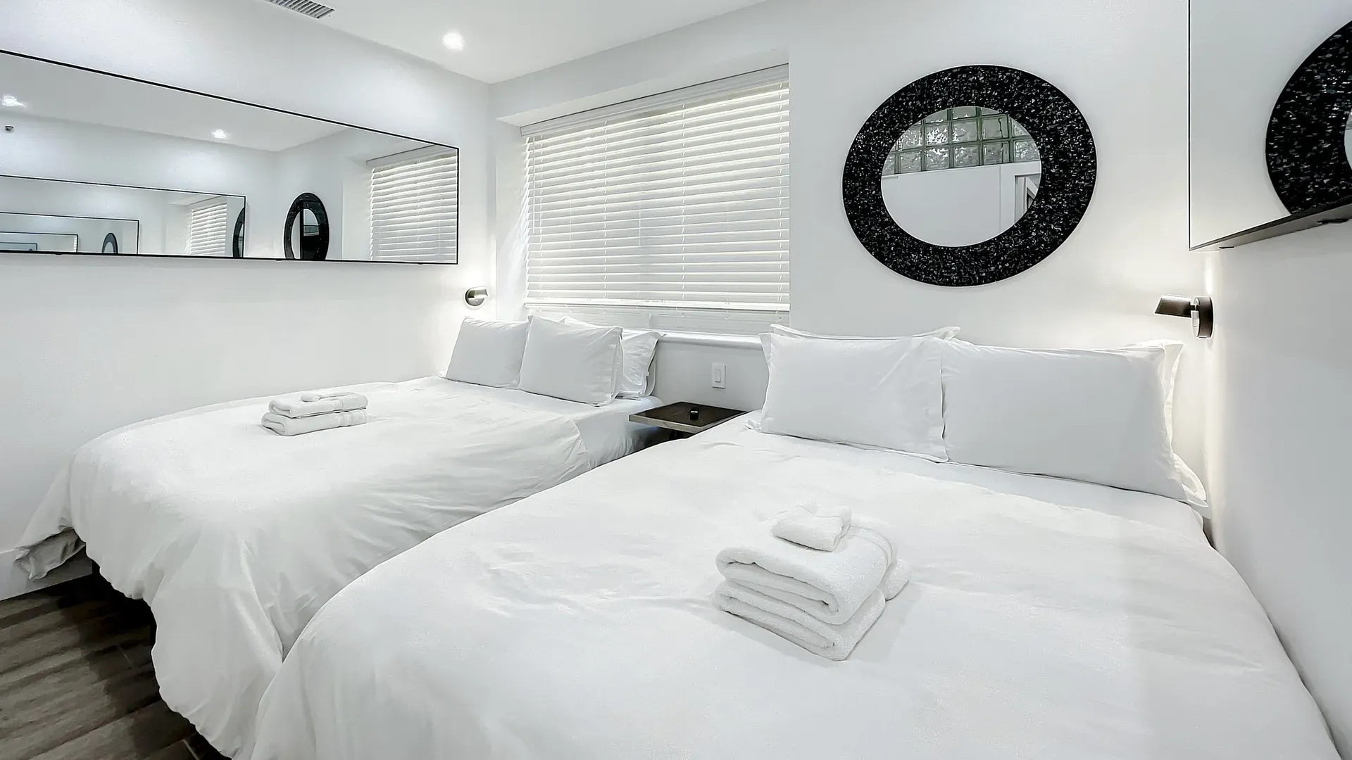 Modern Bedrooms with comfortable memory foam mattresses, cozy dimmer lighting, USB chargers and Designer Mirrors