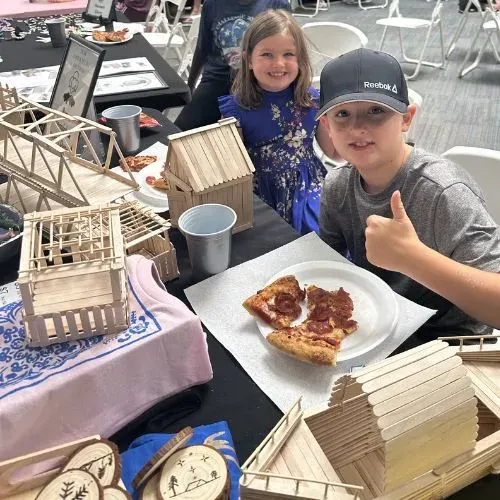 Children setting up business booths