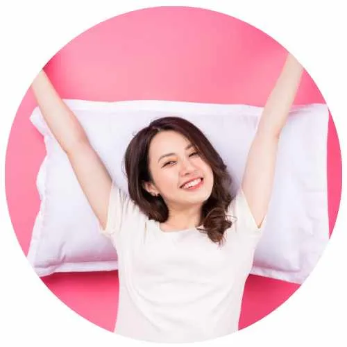 A happy woman in bed