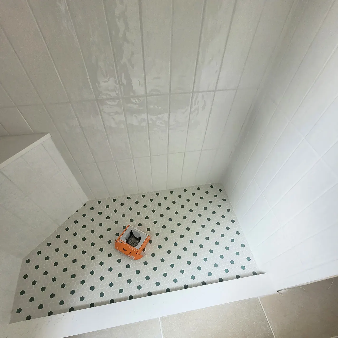 hexagonal tile floor of white shower 