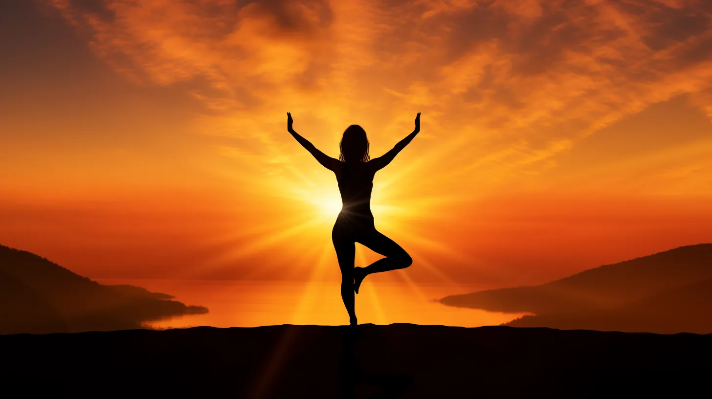 silhouetted figure in a peaceful yoga position with sunrise background subtly imply nude yoga