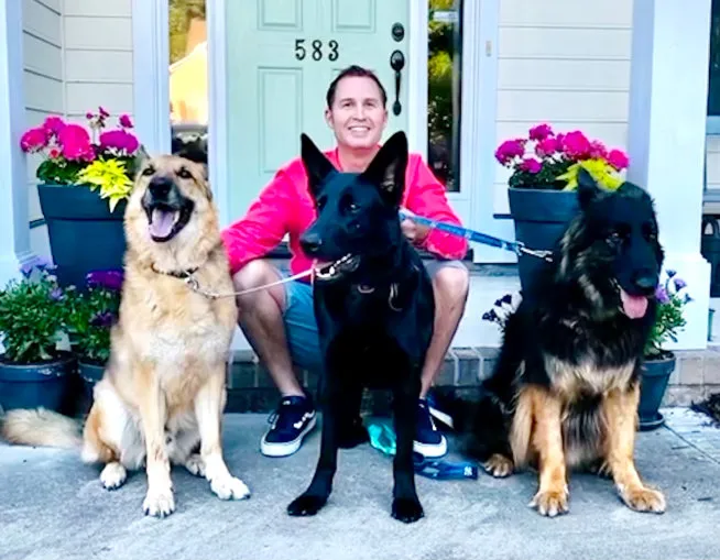 Owner Chris Gulley with his three dogs
