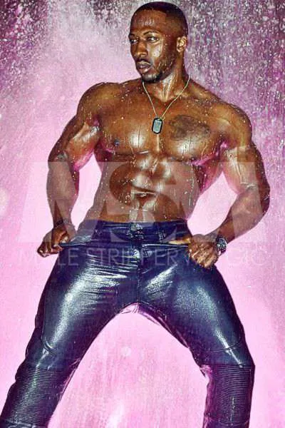 Shirtless Black Male Stripper with Abs, Dog Tags, and Jeans Dancing Wet in the Rain