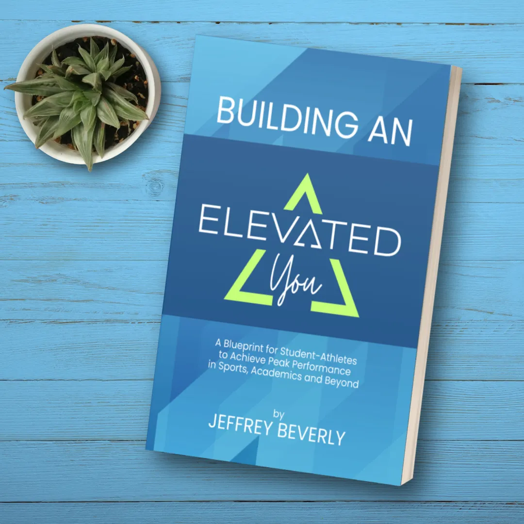 Building an Elevated You book on table with plant