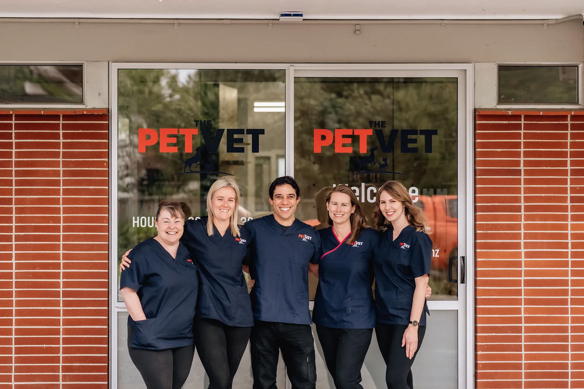 A photo of the Pet Vet Rotorua staff members in front of their clinic