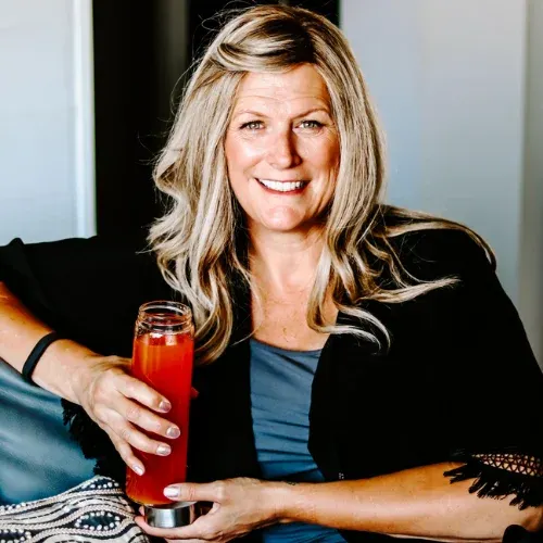 Terri sitting on couch drinking