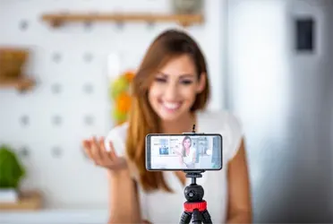 A woman goes live in front of a phone