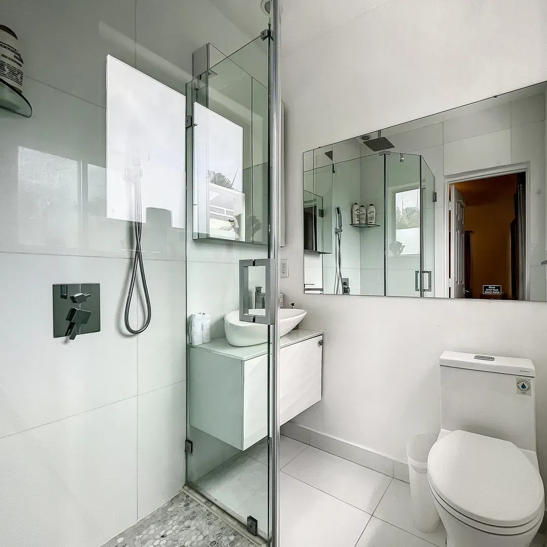 Chic bathroom with tiled walls and modern vanity at Villa Laurell Estate