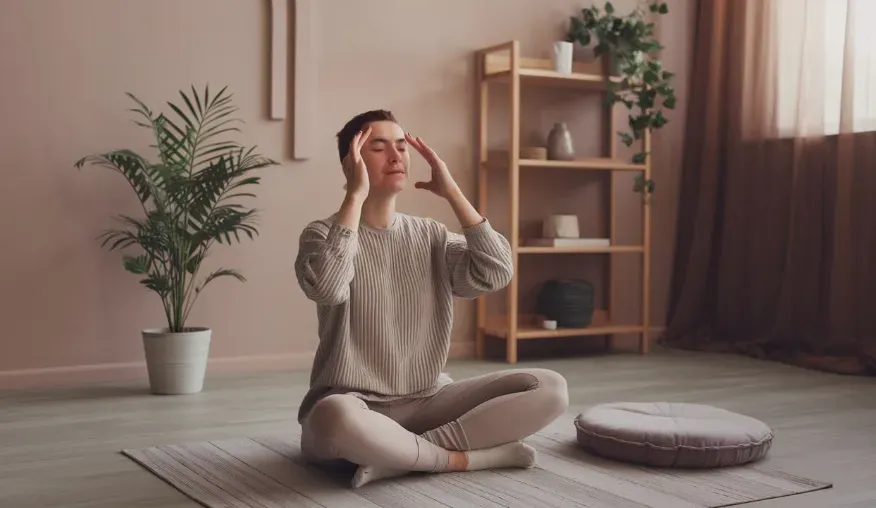 a calming scene where an individual uses their fingers to gently stimulate the third eye point