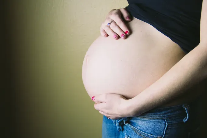 Pregnant woman showing baby bump