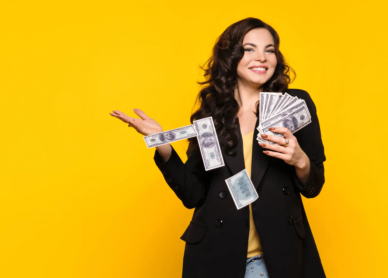 Happy woman with lots of money in her hands.