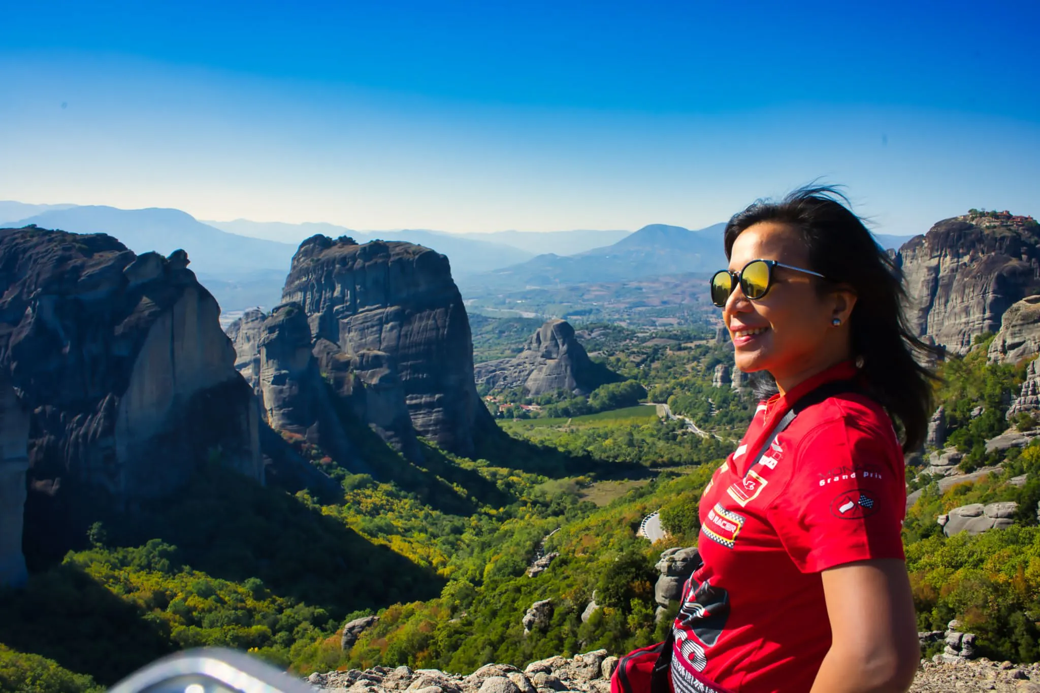 Join Dr. Ma Cherie Cortez as she enjoys the mesmerizing views of Meteora in Greece, integrating adventure into her transformative retreat programs. Discover how her unique approach combines professional development with breathtaking travel experiences for unparalleled personal and professional growth.