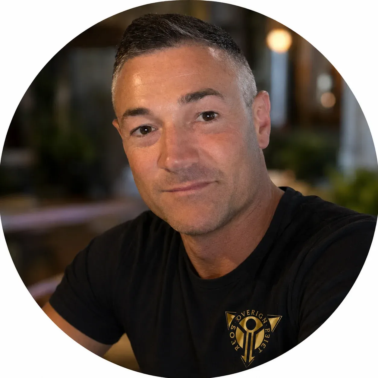 Realistic cartoon portrait of Karl wearing a black Sovereign Project T-shirt with gold logo, shown in a circular testimonial image, friendly and approachable expression.