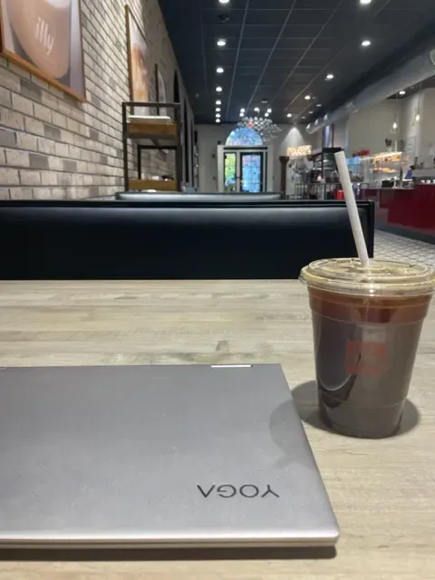 My Yoga laptop and coffee as I research information for this blog