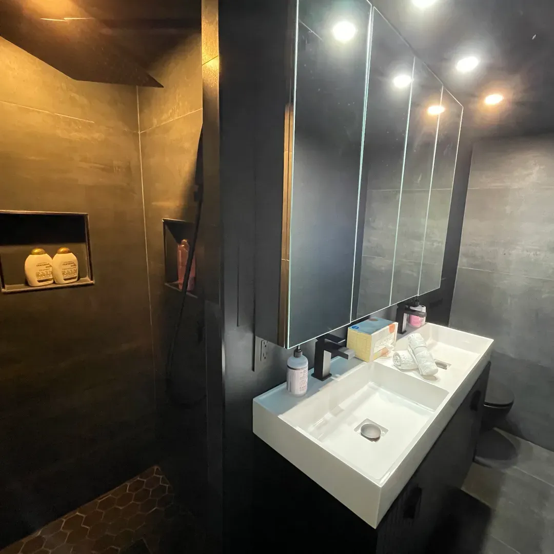 Bathroom with double mirror cabinet