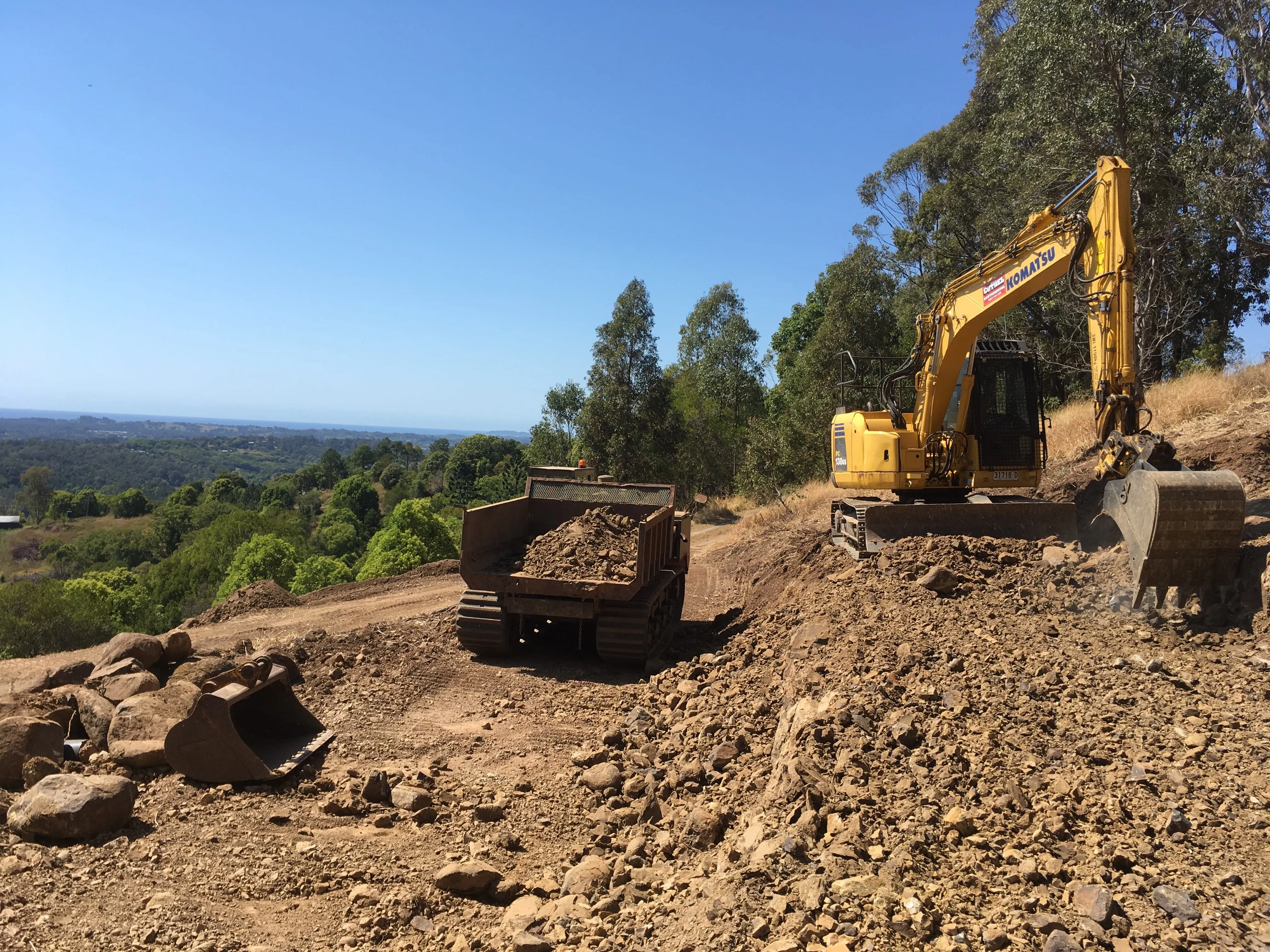 tracked dump truck, excavator, property improvements