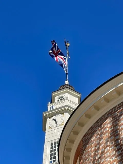 flag over the Capitol Building in Williamsburg where James Madison was active in government prior to writing the US Constitution