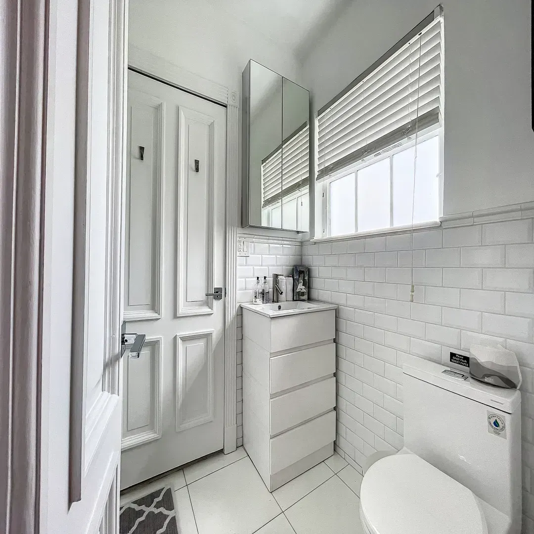 Modern bathroom with dual sinks and premium amenities at Villa Laurell Estate