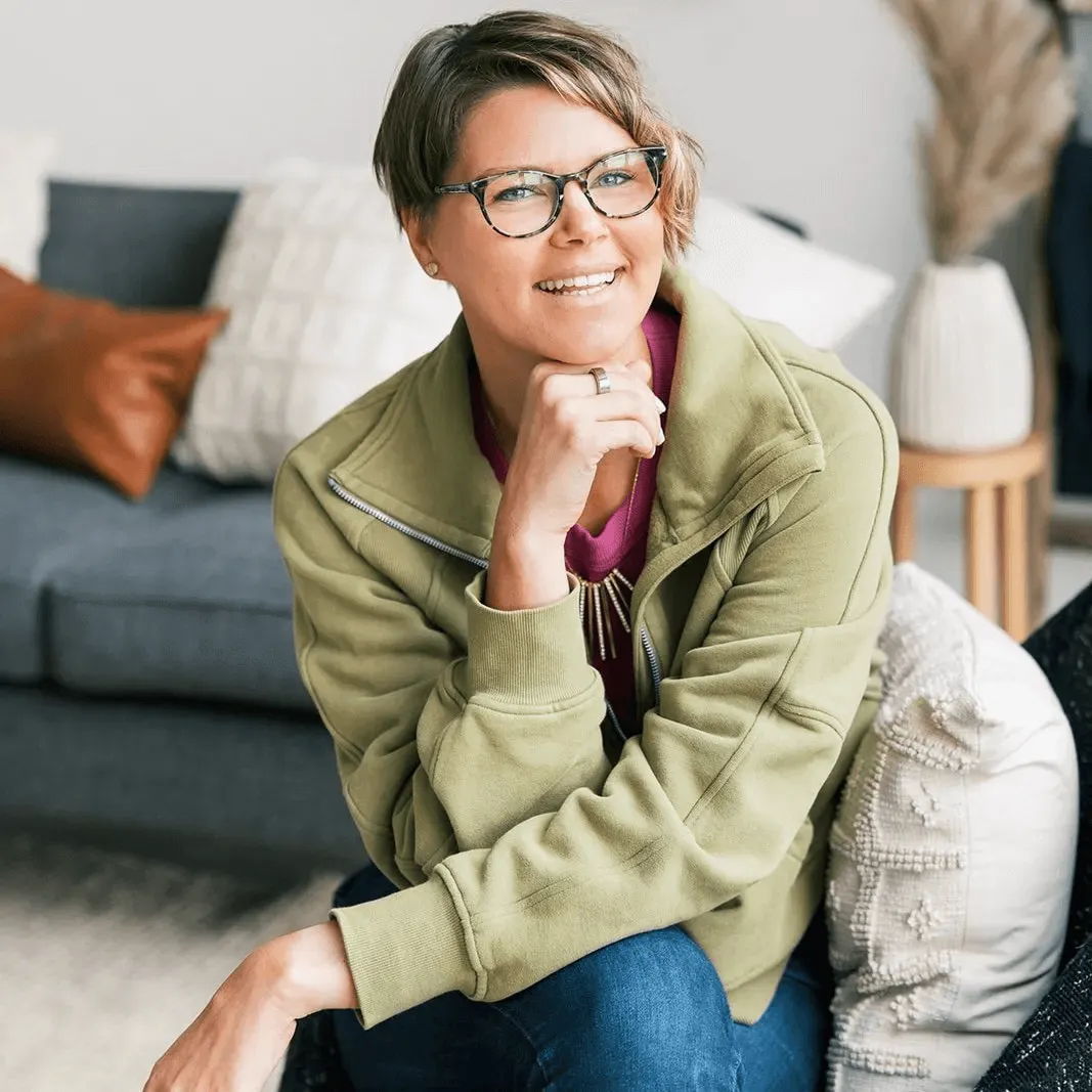 Ellen Argo sitting on a chair smiling