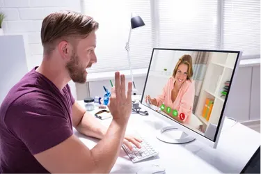 A man sitting in front of a computer