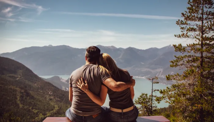 A couple overlooking a mountaintop together.