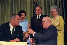 LBJ and Harry Truman Signing Medicare Bill