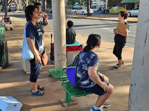 Helping people at the bus stop July 29 2023 512x384