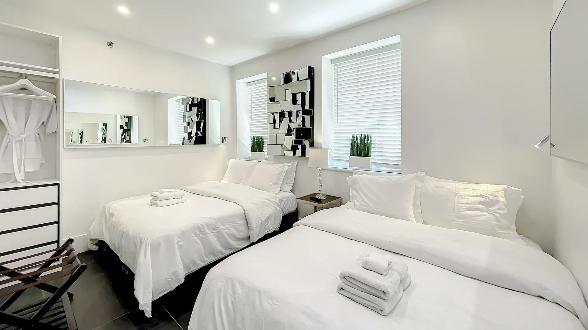 Bedrooms with comfortable memory foam mattresses, cozy dimmer lighting, USB chargers and Designer Mirrors