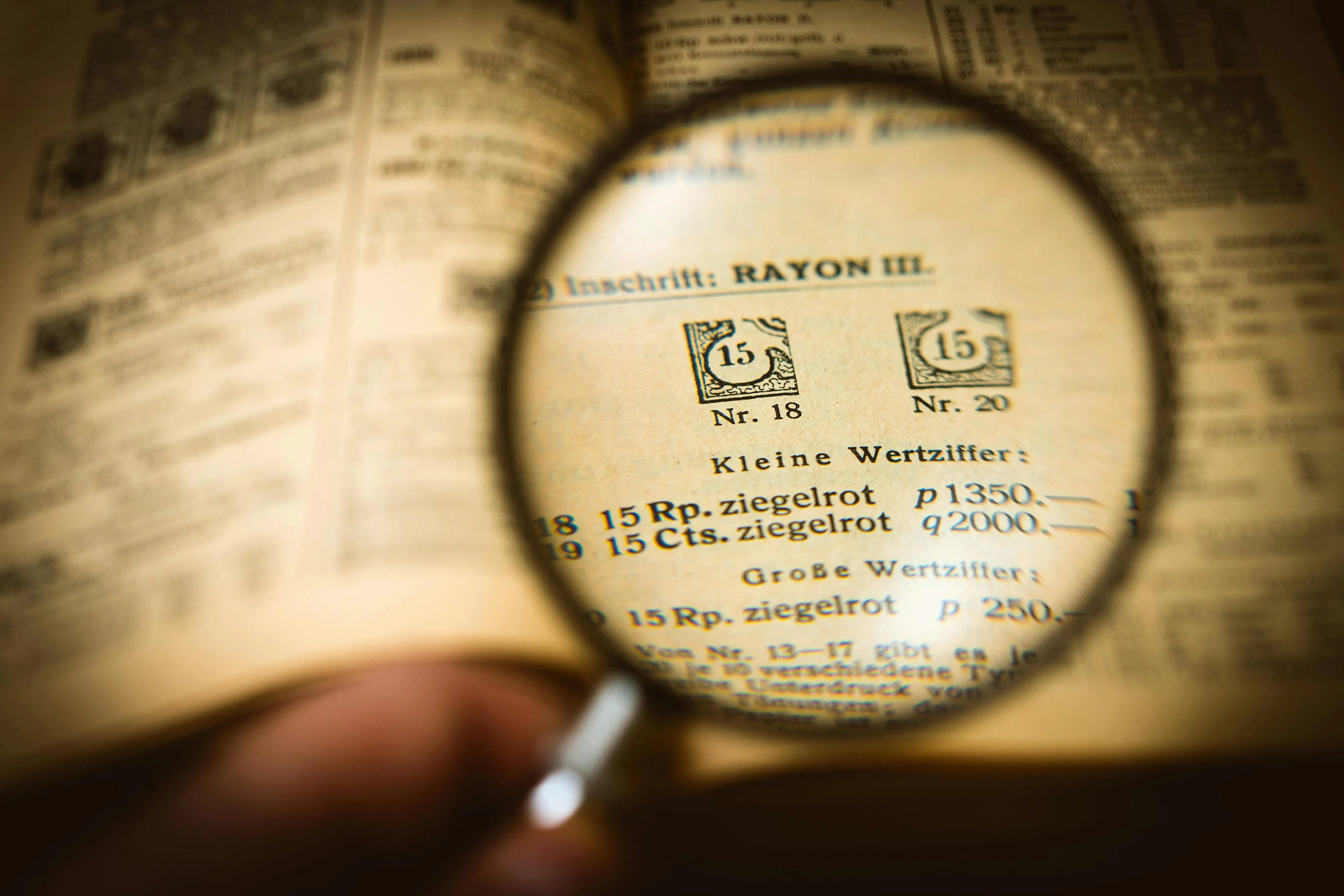 Magnifying glass examining layered scrolls, symbolizing a clear overview of the Six Pillars inside Vault Hustle.