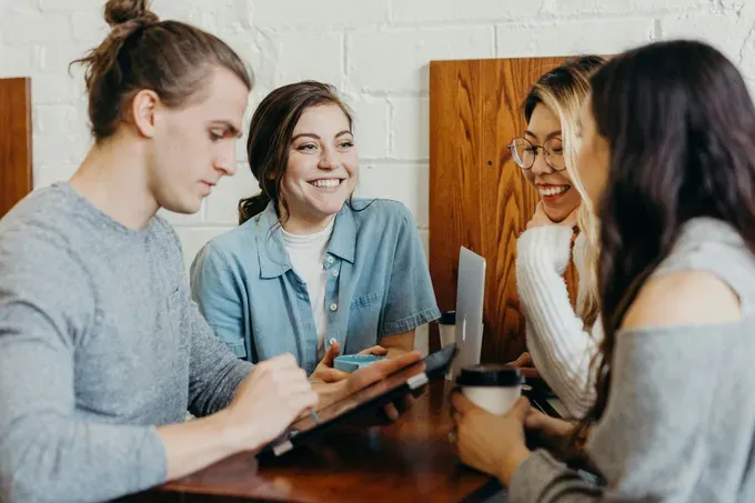 group of young people in a business meeting