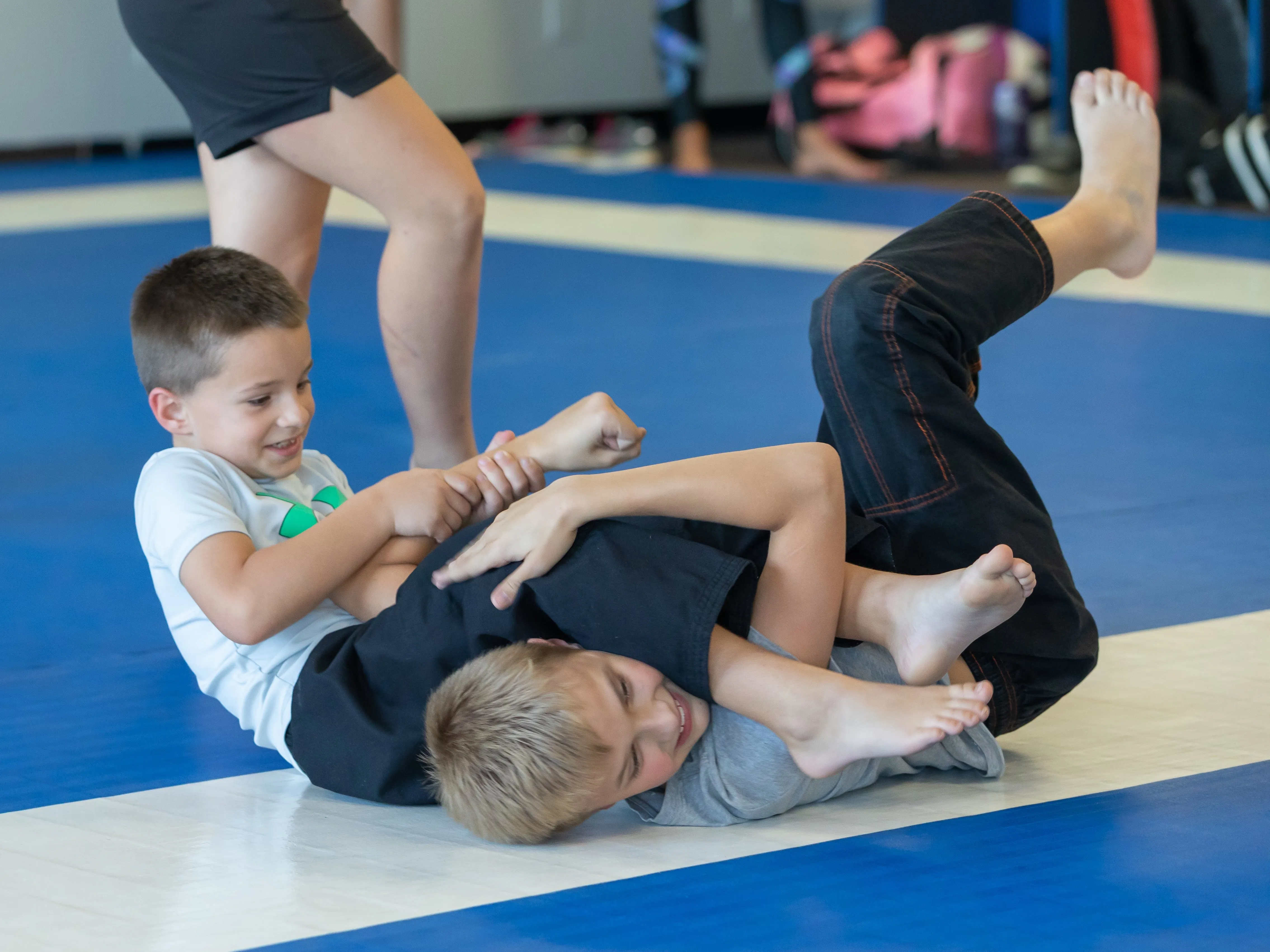 two kids practicing grappling