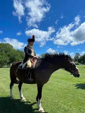 Mark Schneider portraying the Marquis de Lafayette in Colonial Williamsburg answering questions about horses during the American Revolution