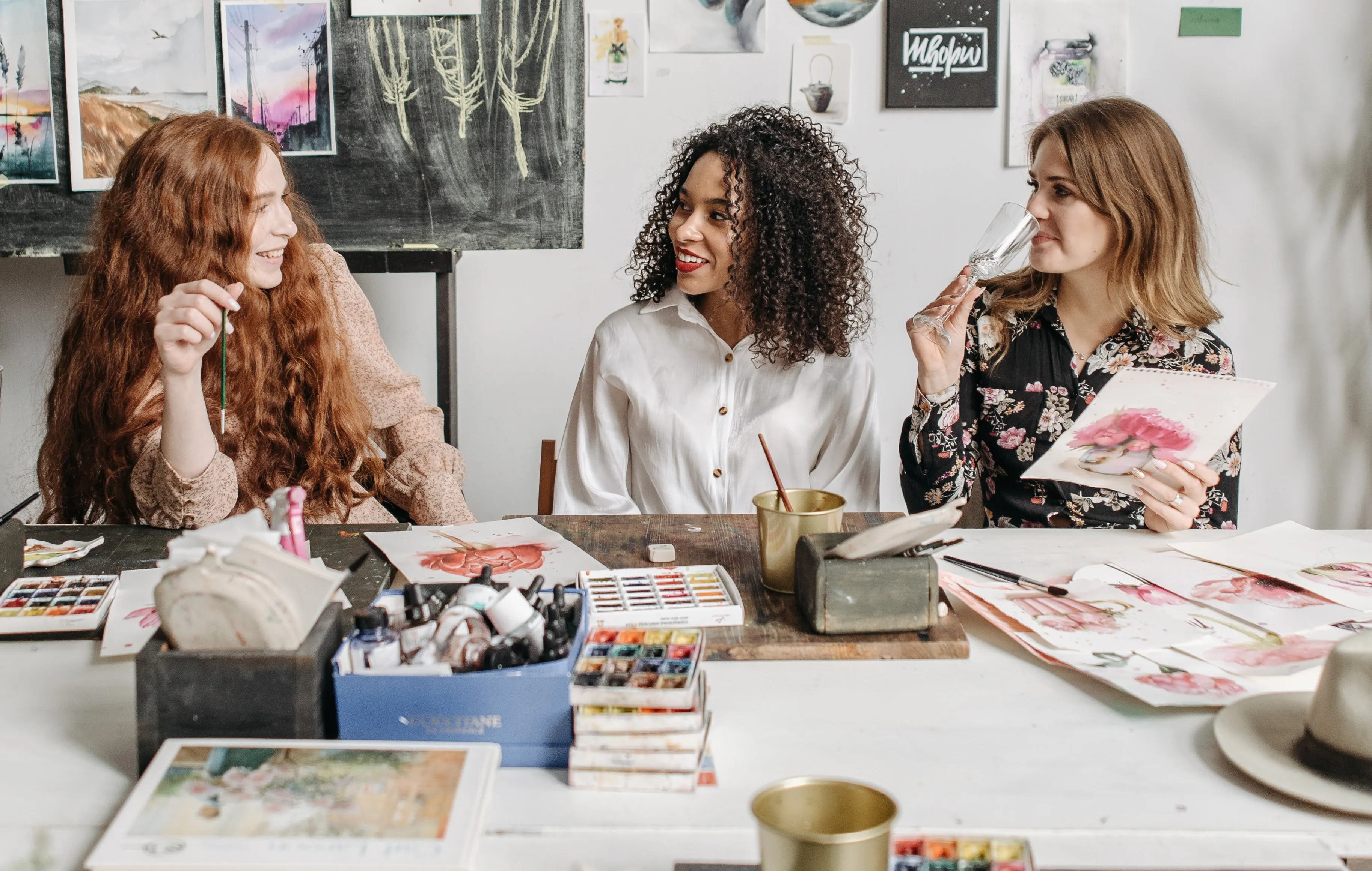 women friends creating art and talking